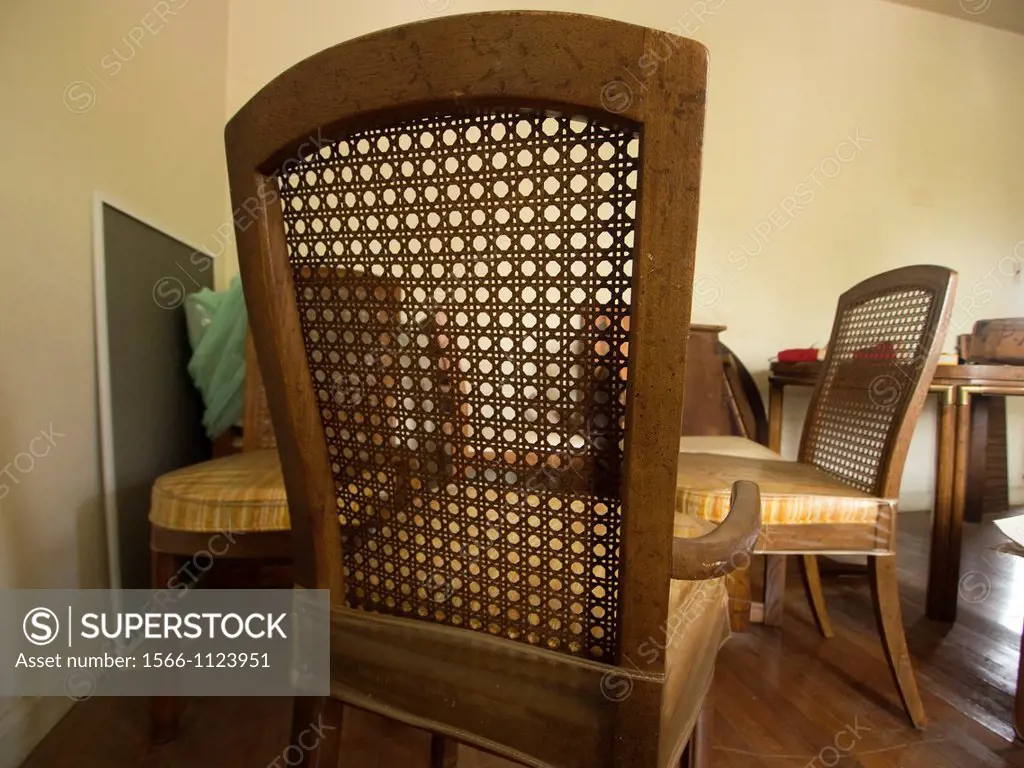 Skewed chairs in unkept room inside of a foreclosed house in Bronx, New York, United States