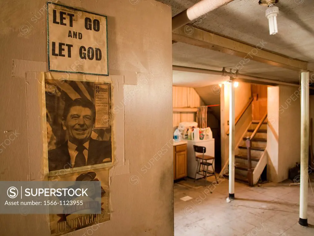 Reagan poster in dirty basement inside of a foreclosed house in Bronx, New York, United States