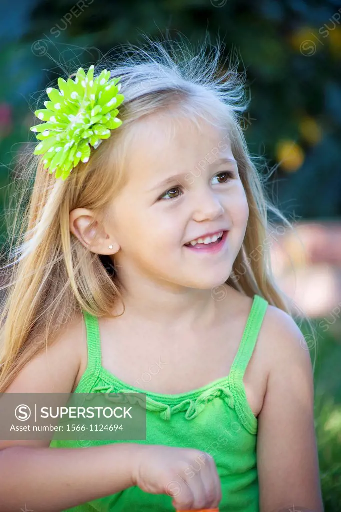 beautiful little girl in green