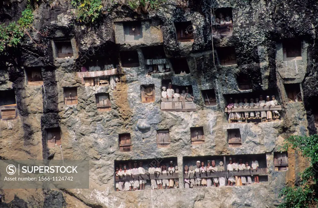 Figures depicting ancestors at Tau-tau cliff, traditional cemetery of Suaya, Tana Toraja  Sulawesi, Indonesia