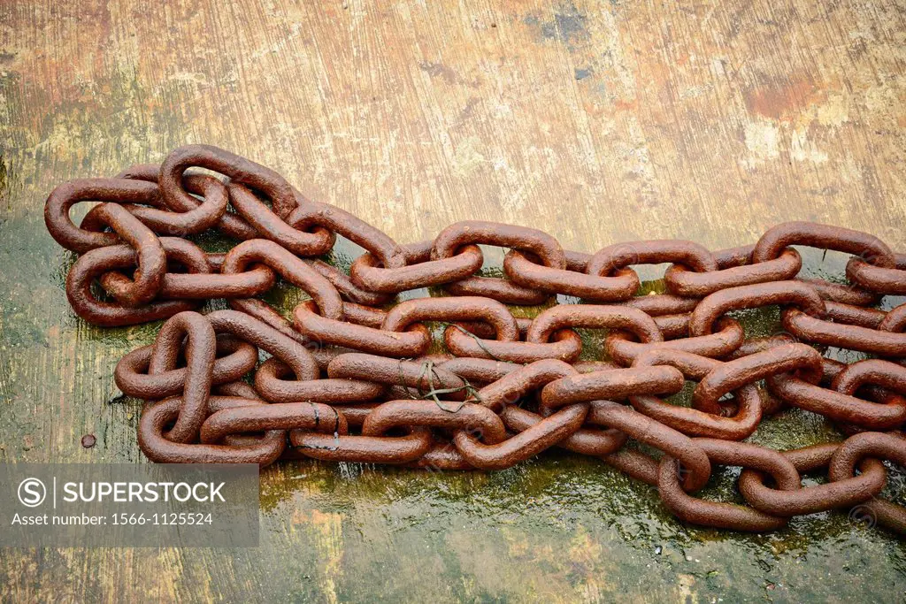 Detail of old rusted chain used to moor boats
