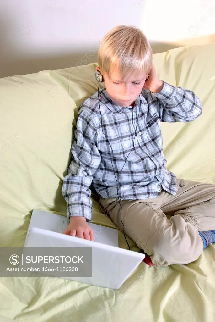 Laptop use  Boy using a laptop computer