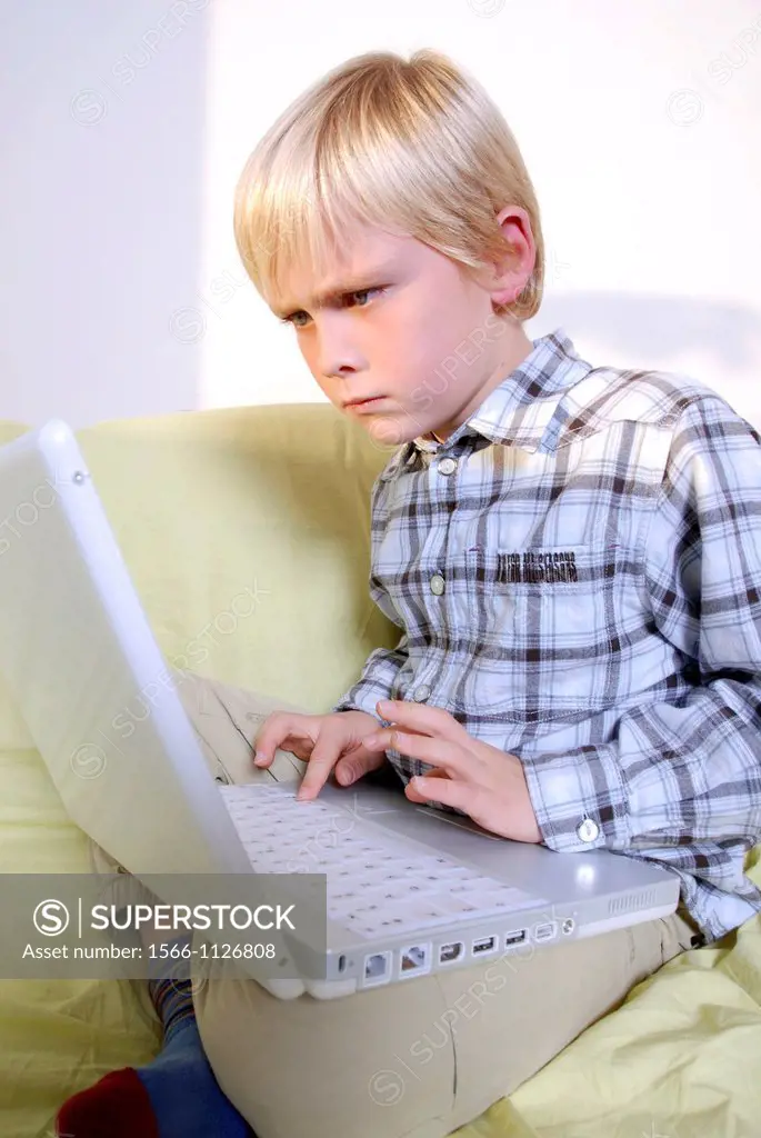 Laptop use  Boy using a laptop computer