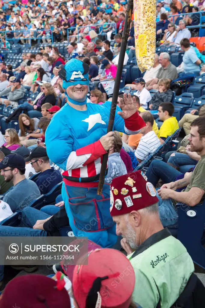 Grand Rapids, Michigan - On Super Hero Night at Fifth Third Ballpark, the popcorn vendor dressed as Captain America during a minor league baseball gam...