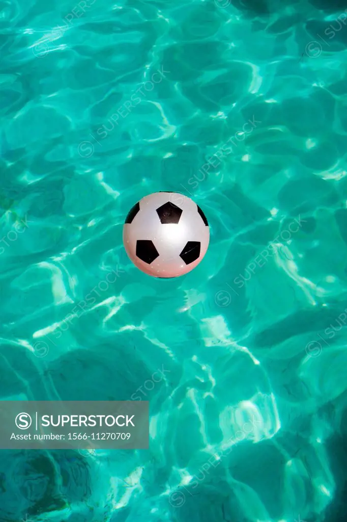 Pink ball in a swimming-pool.