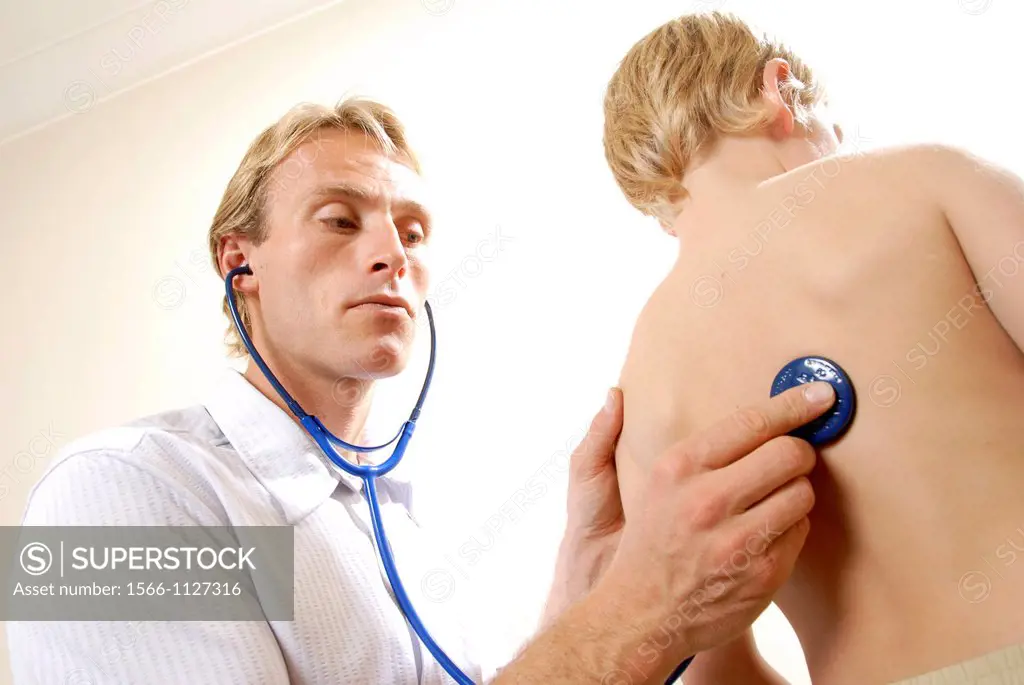 Paediatric examination  Doctor listening to a young boy´s chest