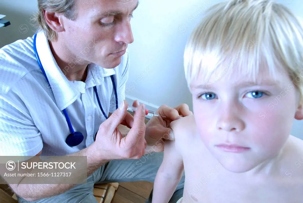 Vaccination  Doctor injecting a boy with a vaccine