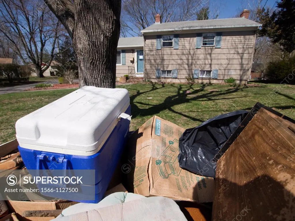 Pile of trash outside of a foreclosed home in Warwick, Rhode Island