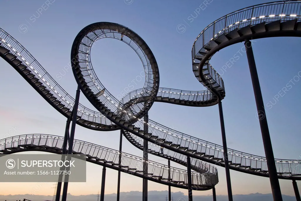The walkable, large outdoor rollercoaster shaped sculpture Tiger & Turtle - Magic Mountain, landmark in Duisburg-Angerhausen, Duisburg, North Rhine-We...