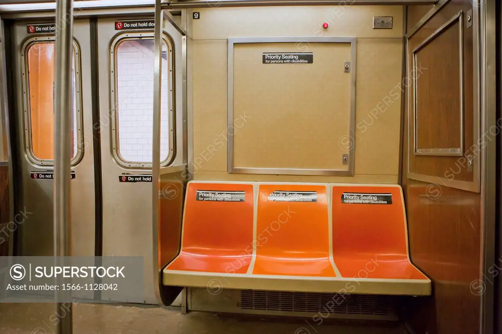 Empty Priority Seating in New York City Subway cart with doors closed