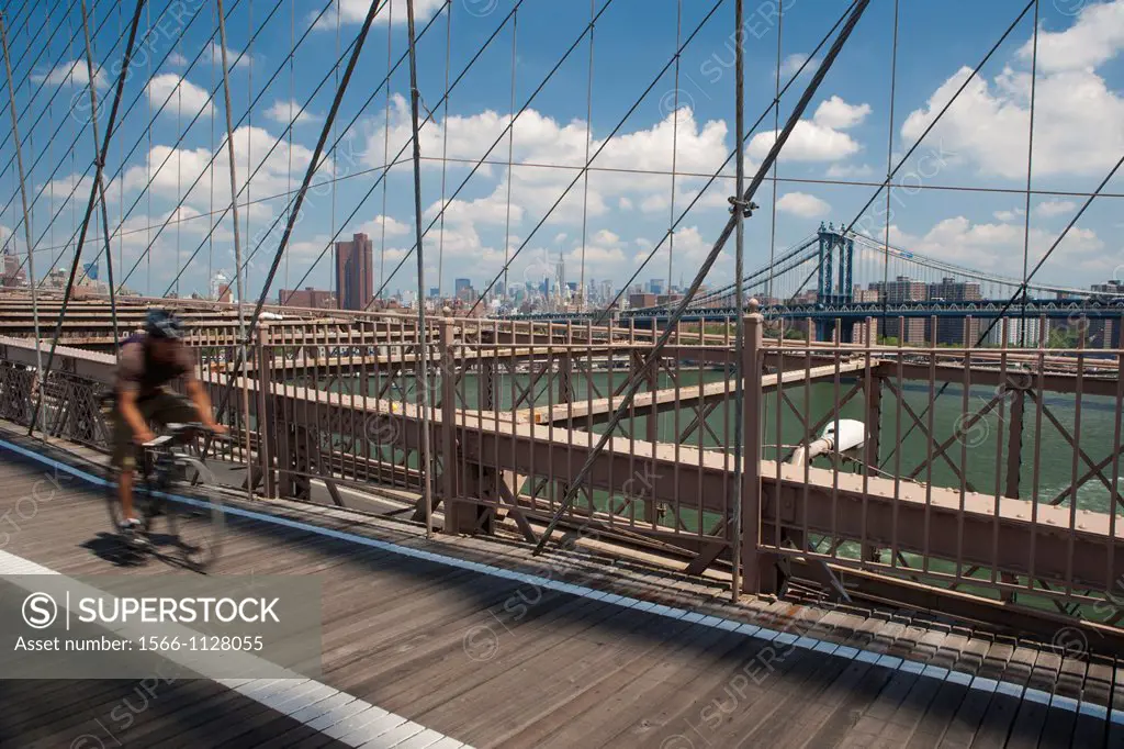 Cyclist crossing the Brooklyn Bridge