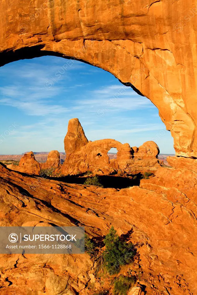 Turret Arch seen through North Window at sunrise, Arches National Park, Utah, USA