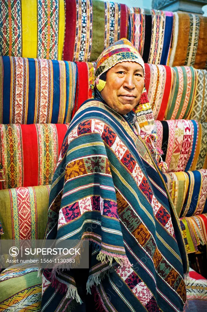 Woman with llama dressed on traditional dress, Cuzco, Peru.