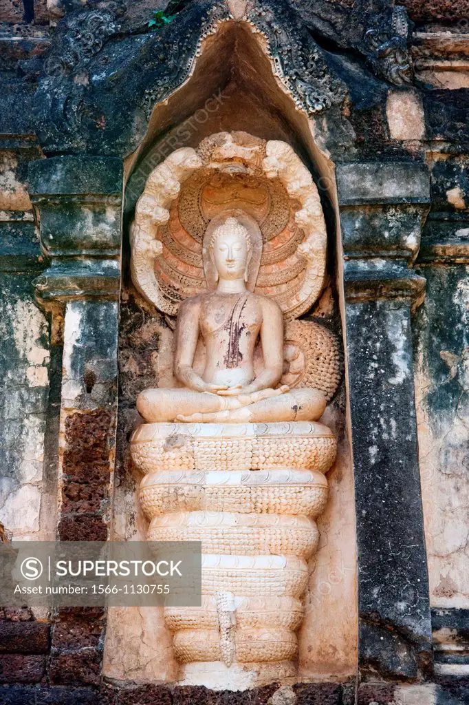 Seated Buddha statue inside Wat Chedi Chet Theo, Si Satchanalai, Thailand