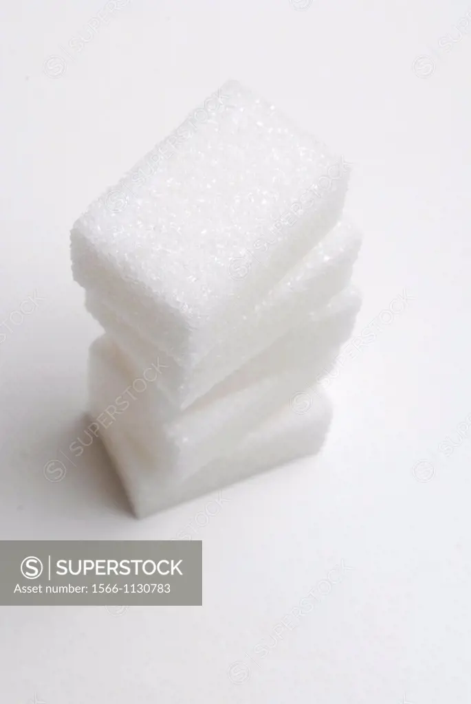 Stack of five cubes of refined white sugar sucrose