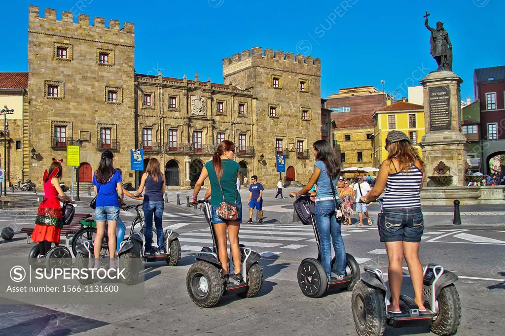 People riding a segway at Revillagigedo Palace, Gijón, Asturias, Spain