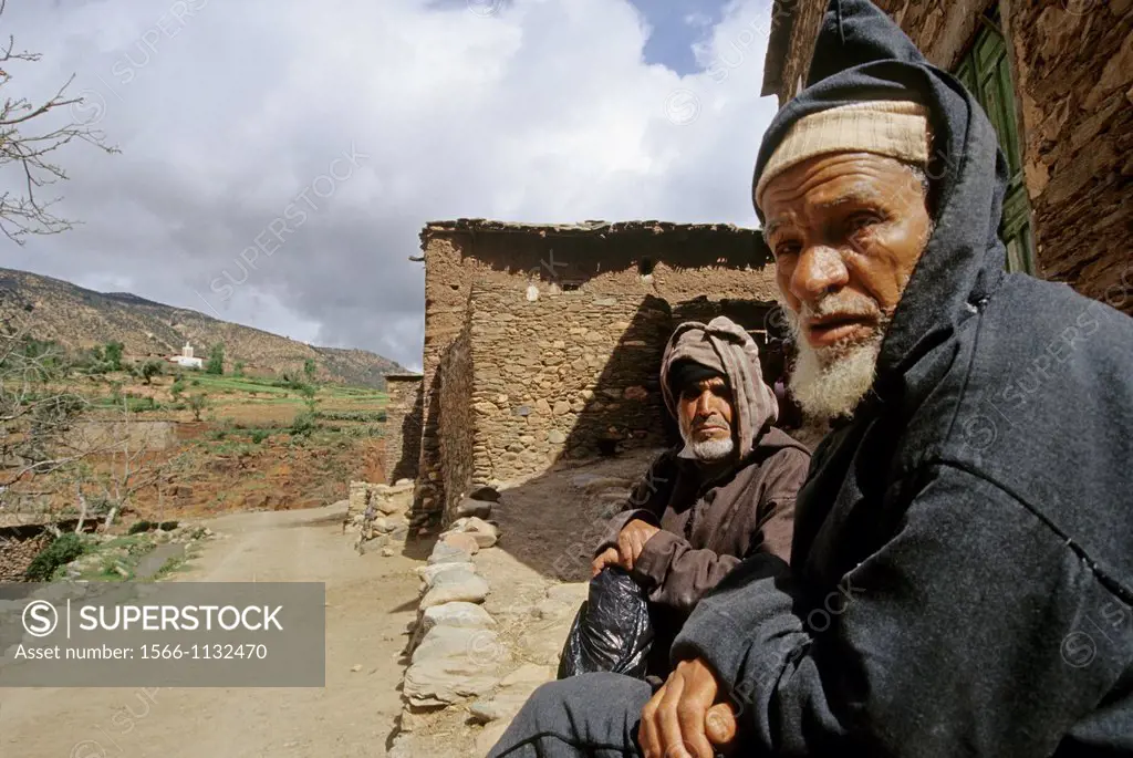 men at the entrance of Tirgui, High Atlas, Morocco, North Africa