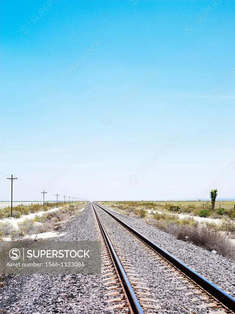 Train tracks and a clear blue sky, outside of Real de Catorce, Mexico, Shows perspective and depth