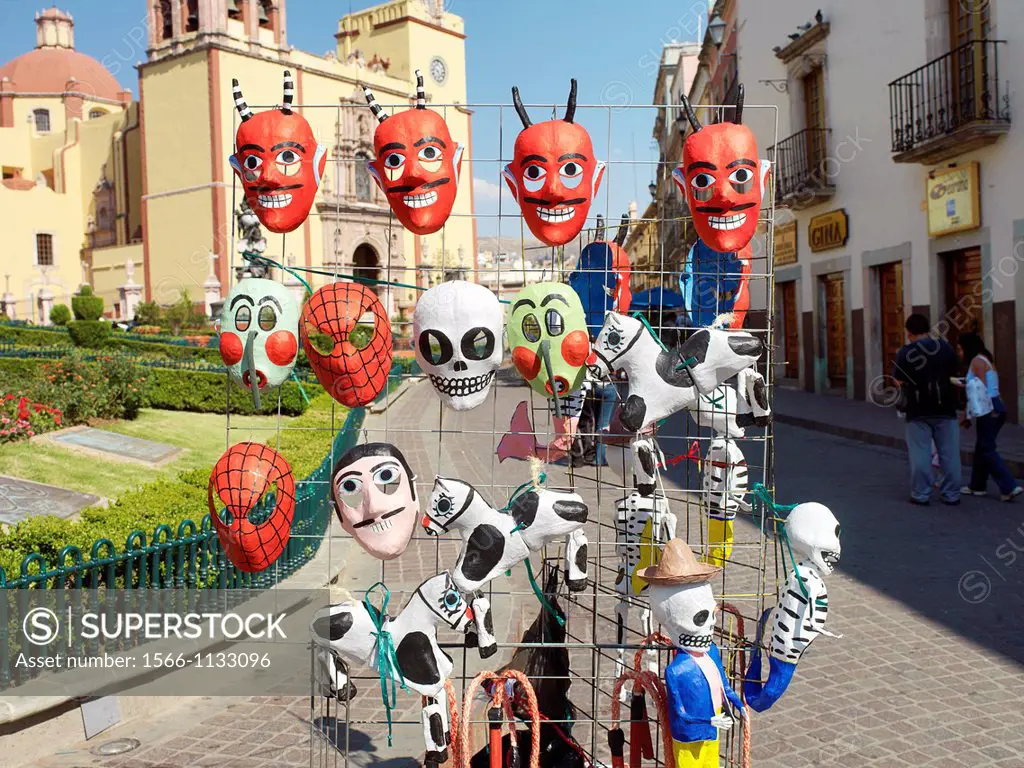 Mexican masks of good and evil outside the main church