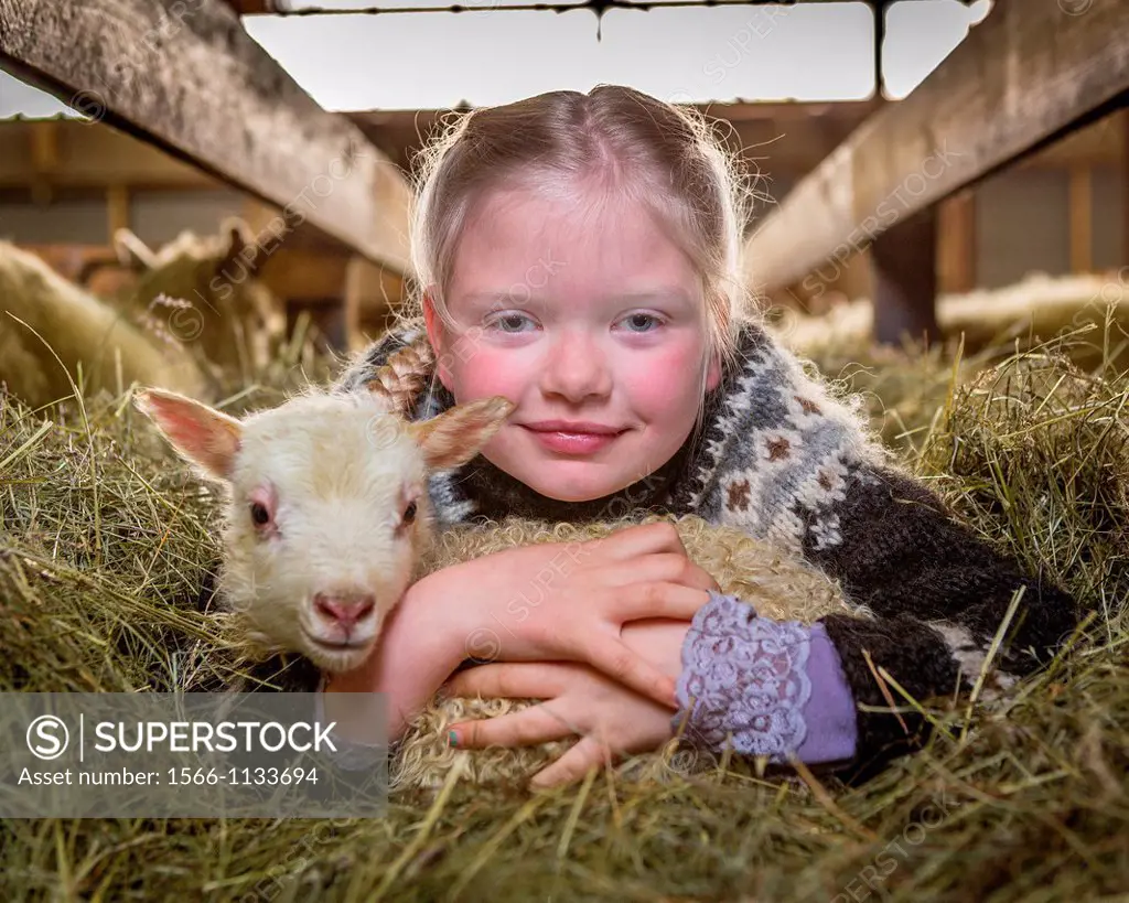 Girl with young lamb, Western Iceland