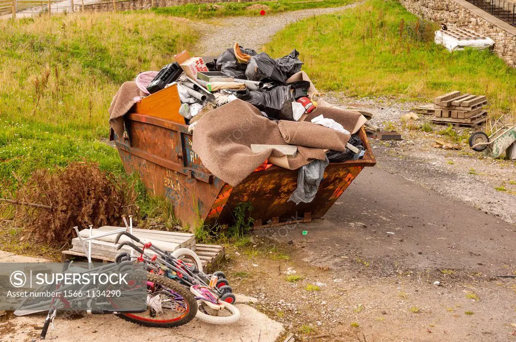 A rubbish skip and junk in the Uk