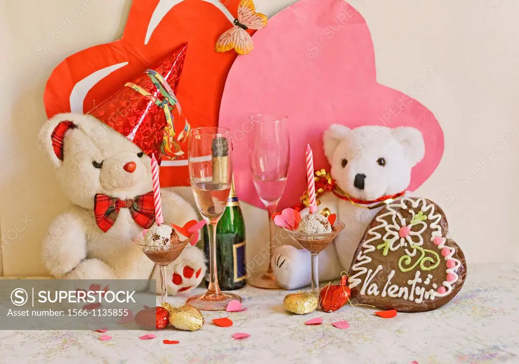 Teddy Bear Valentine  Fatso Bear shares Valentine or anniversary with a white teddy bear  There are two tall pink-stemmed wine glasses, bottle of sekt...