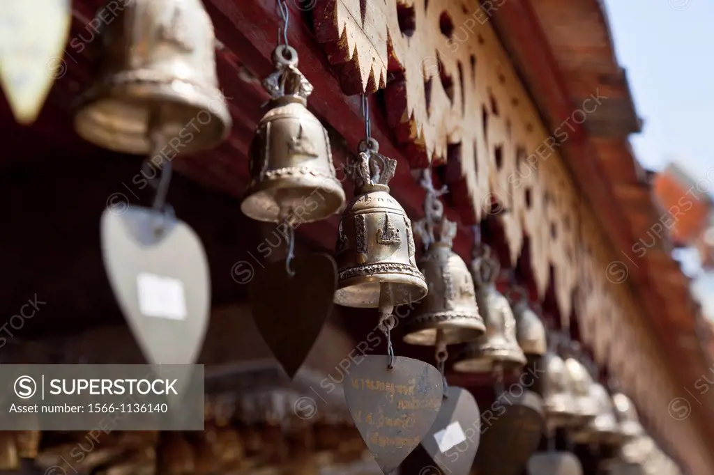 Row of small prayer bells bearing personal messages, Wat Phrathat Doi Suthep, Chiang Mai Province, Thailand