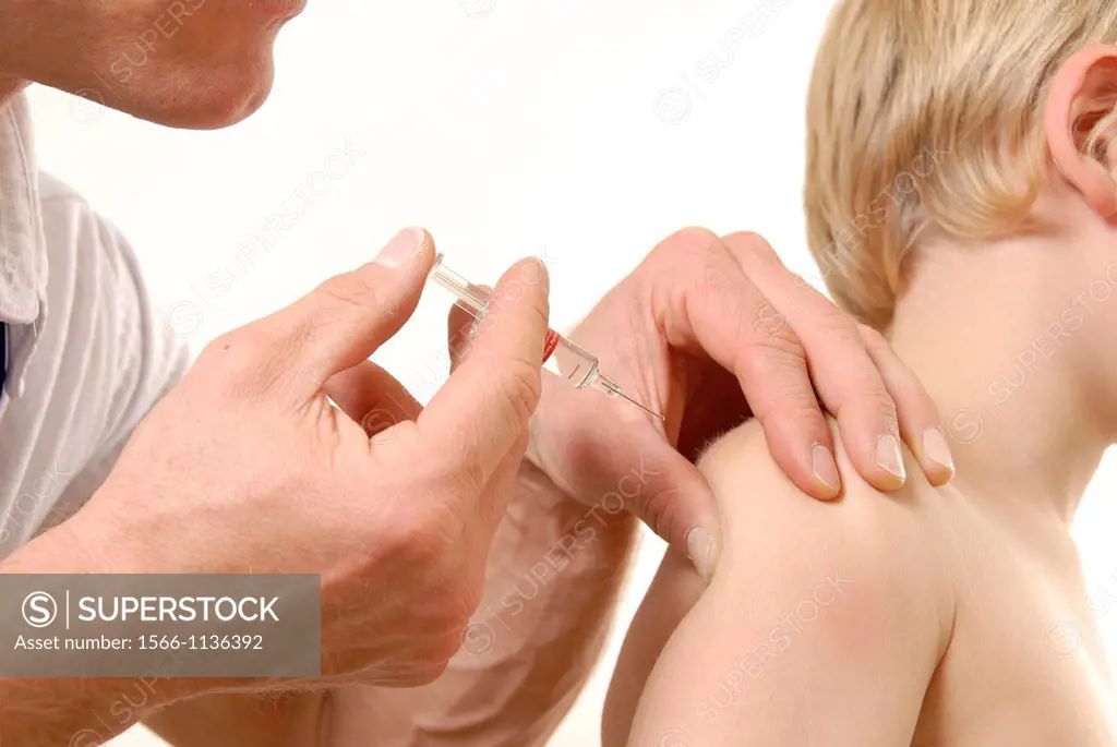 Vaccination  Doctor injecting a boy with a vaccine