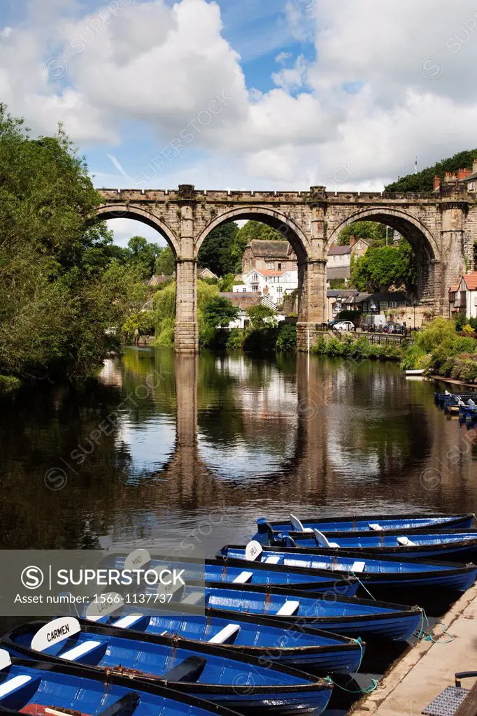 Rowing Boats on the River Nidd and Railway Viaduct at Knaresborough North Yorkshire England