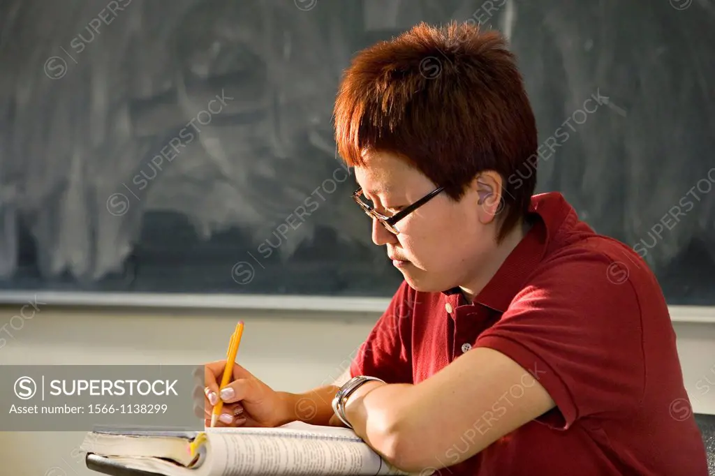 Asian graduate student in class