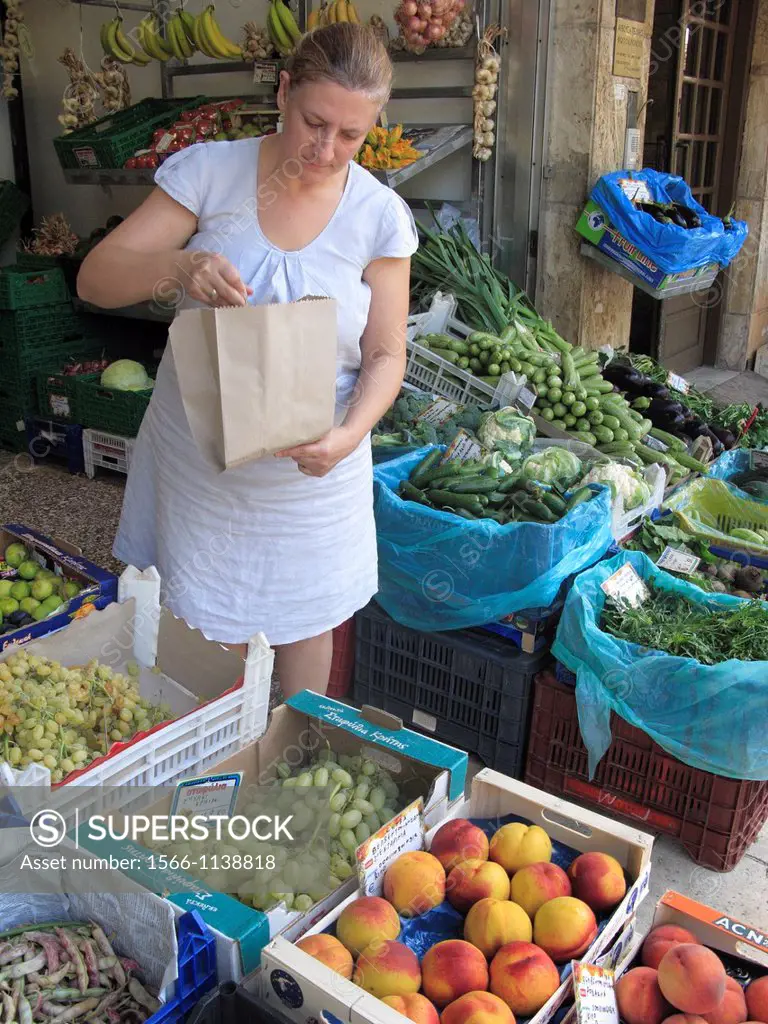 Woman buying Fruit from a Greengrocers, Chania, Crete, Greece