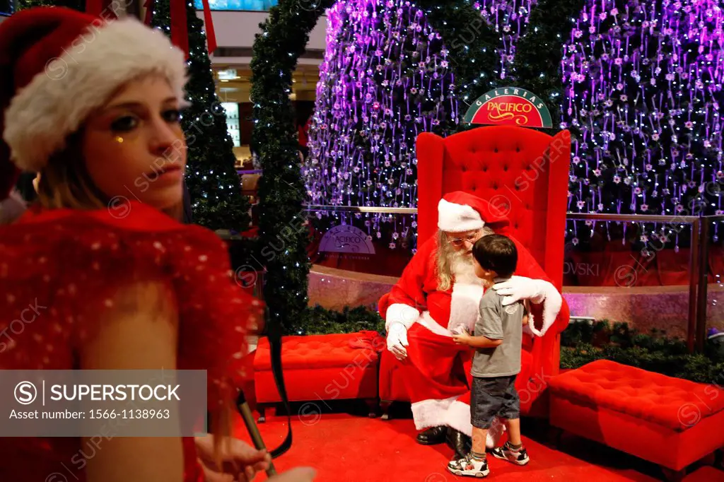 People being photographed with Santa Claus at Galerias Pacifico shopping mall, Buenos Aires, Argentina
