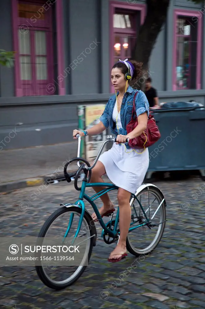 Woman riding bicycle at the trendy neighbourhood of Palermo Soho, Buenos Aires, Argentina