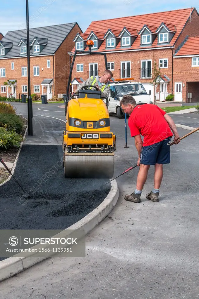 construction workers mending pavement,cleveleys,lancashire,england,uk,europe