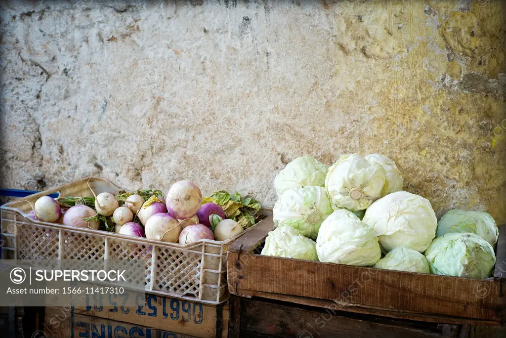 Boxes with vegetables, turnips and cabbage in a street market in the Medina of Fez, Morocco, Africa.
