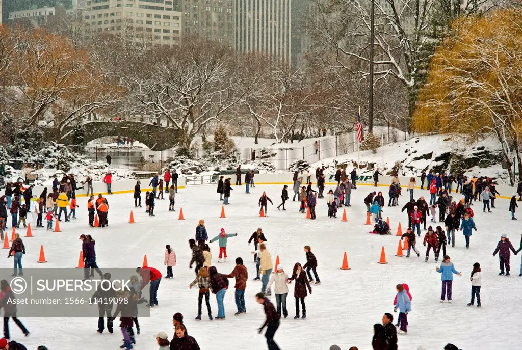 Snow blizzard in Central Park. Manhattan. New York City.Trump Ice Skate Ring.