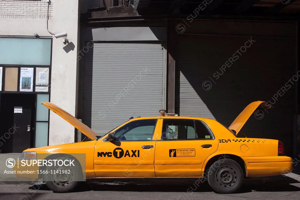 ABANDONED YELLOW TAXI CAB WEST TWENTY FIFTH STREET MANHATTAN NEW YORK CITY USA