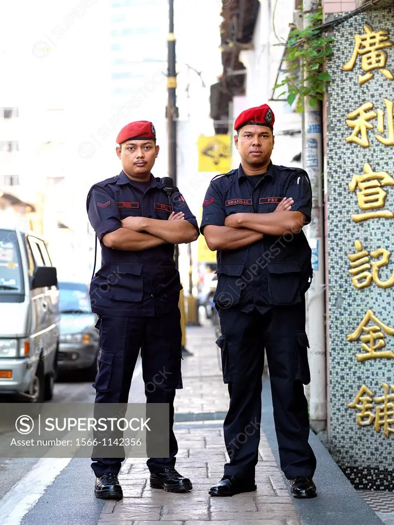 Two security guards striking a pose