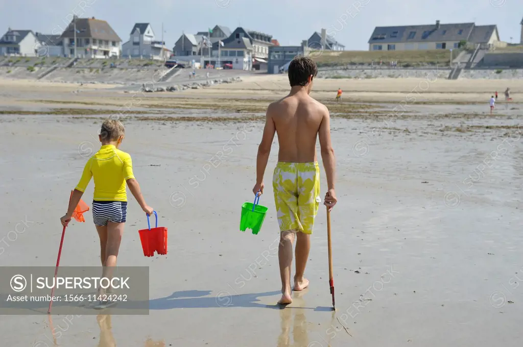 France, Normandy, Man and boy on beach