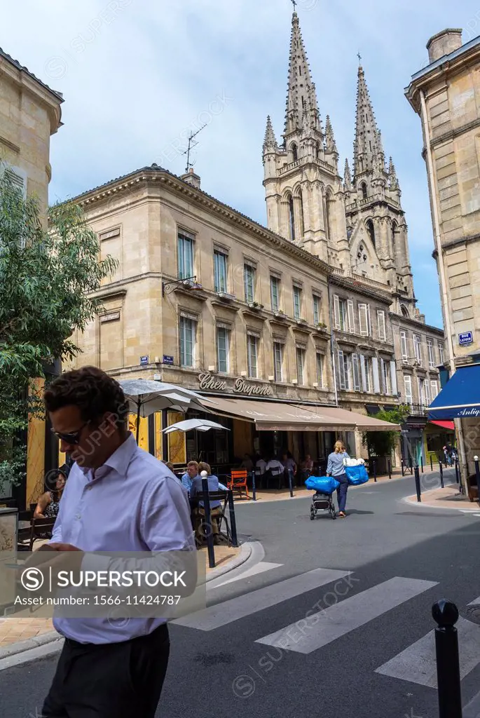 Bordeaux, France, Street Scenes, Man Walking in Chartrons District. Notre Dame Church in Background.  
