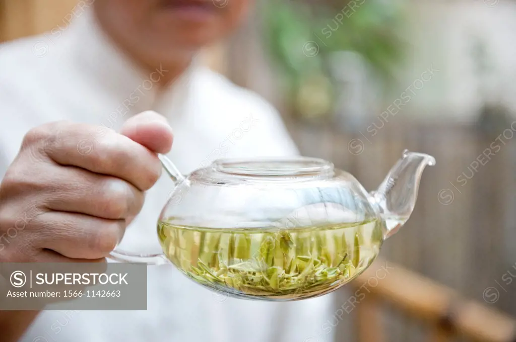 Minglou Chen, owner of the Minglou Tea House displays one of his freshly made teas during a traditional tea ceremony