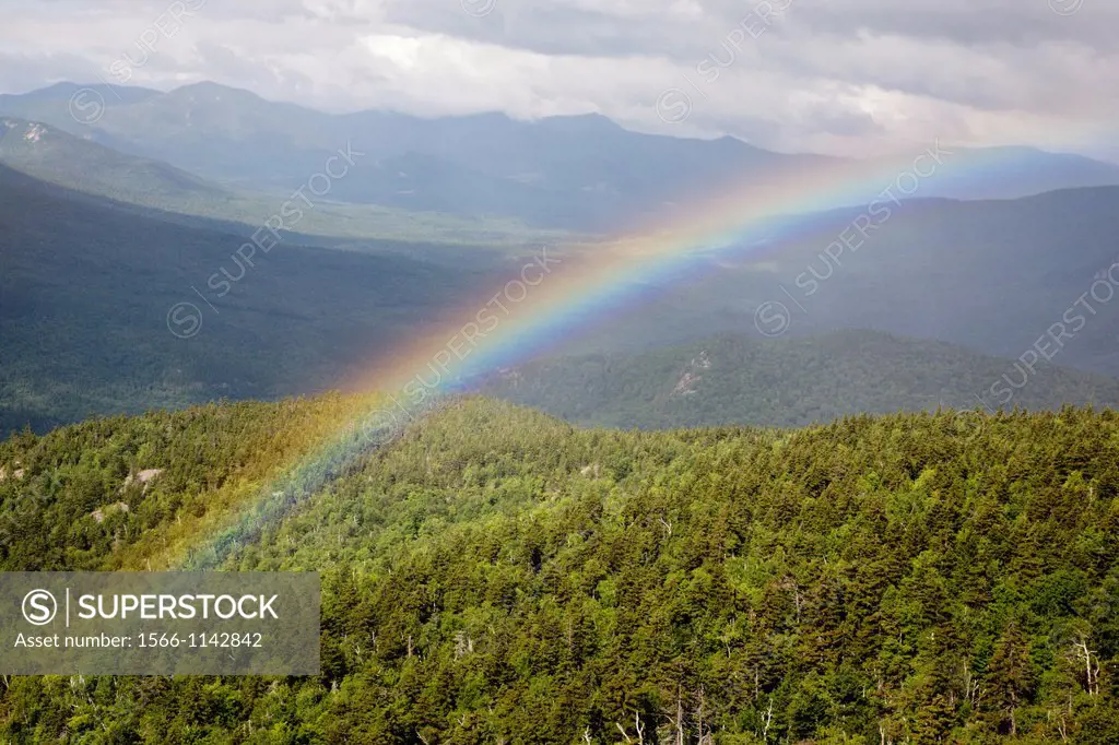Rainbow after a rainstorm during the summer months along the Moat Mountain Trail near South Moat Mountain in Albany, New Hampshire USA