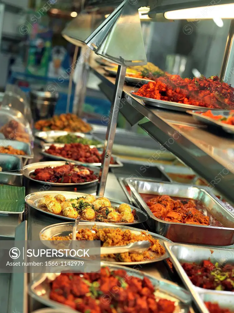 A buffet at an Indian restaurant in Johor showcasing many traditional Indian delicacies