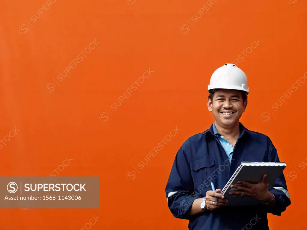 A portrait of a inspector at a commerical container and Palm Oil port in Johor, Malaysia