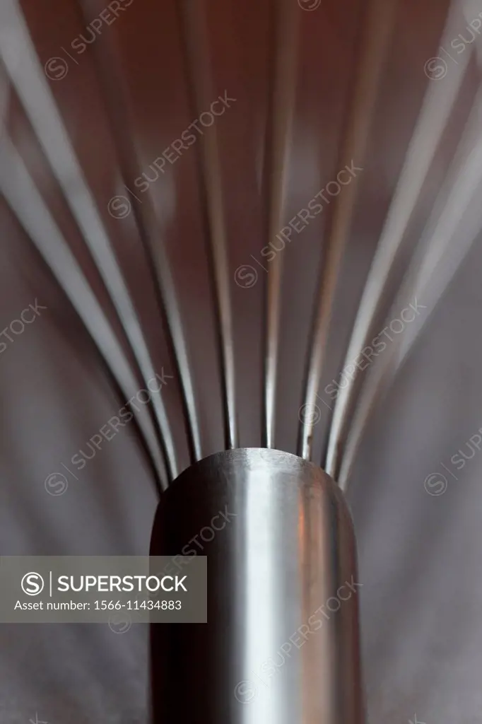 Close up of a metal whisk.