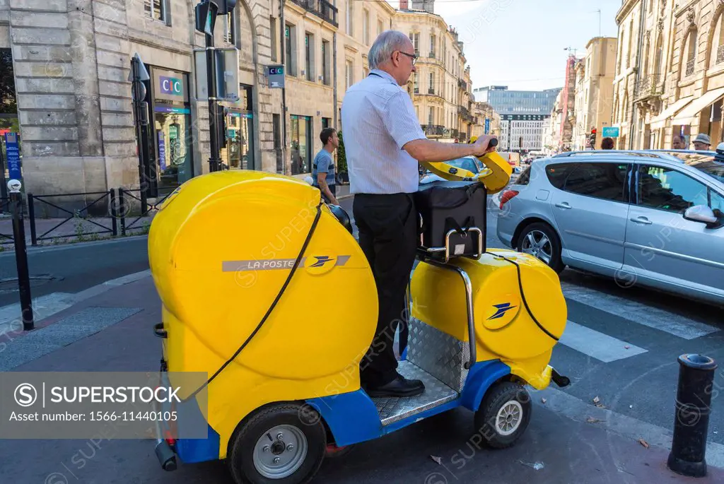 Bordeaux, France, Street Scenes , Mailman on Electric Vehicle delivering mail.