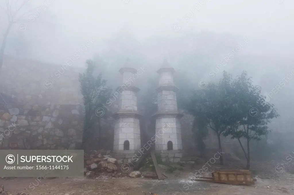 Construction and fog at the San Huang Zhai Monastery on Song Mountain, China