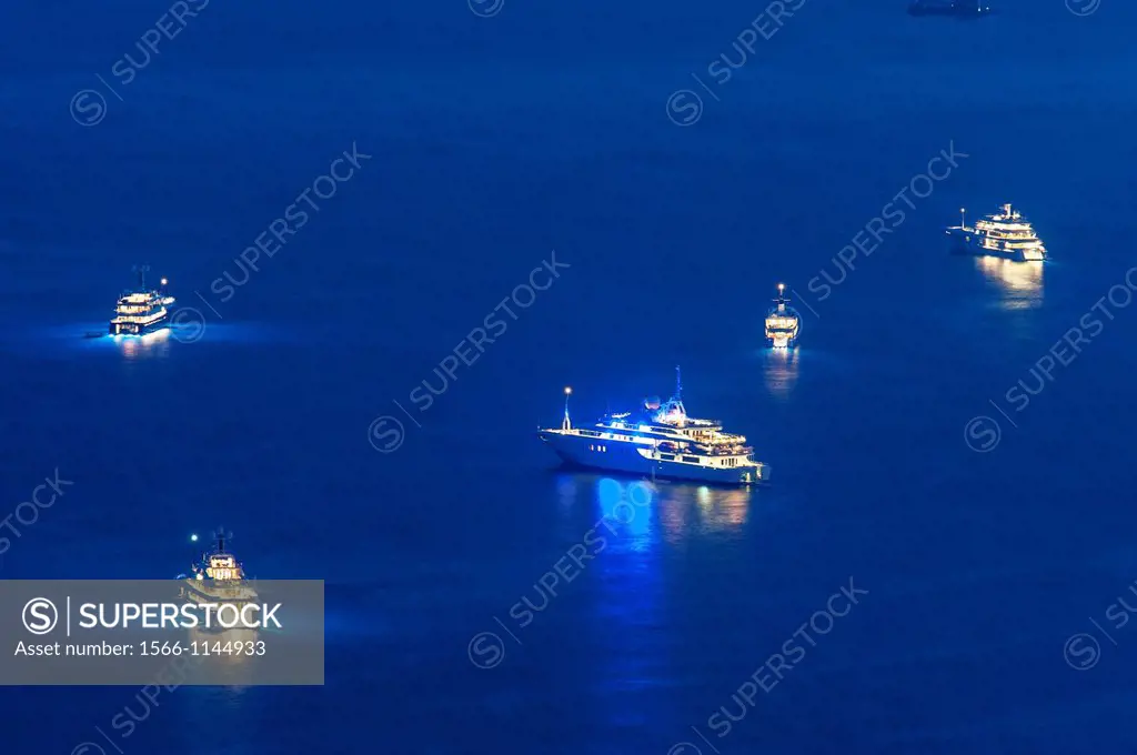 Principality of Monaco, Monte Carlo. Cruise ships off Monaco at night.