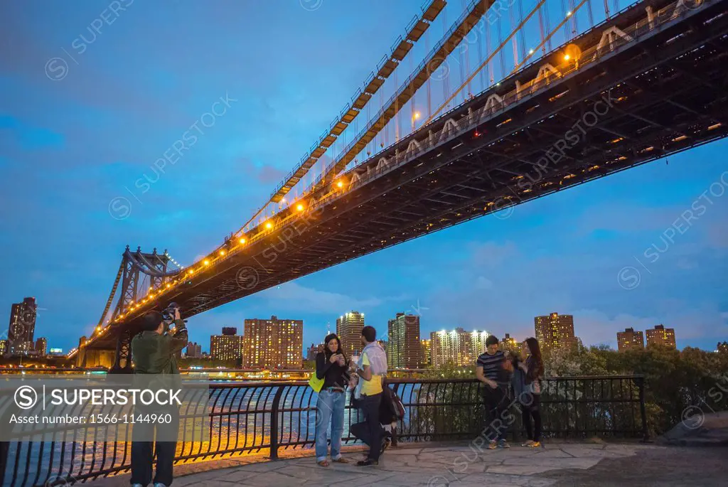 New York City, NY, USA, People Looking at Skyline, from Brooklyn Bridge Park, of Brooklyn Bridge at Dusk, in DUMBO Area,