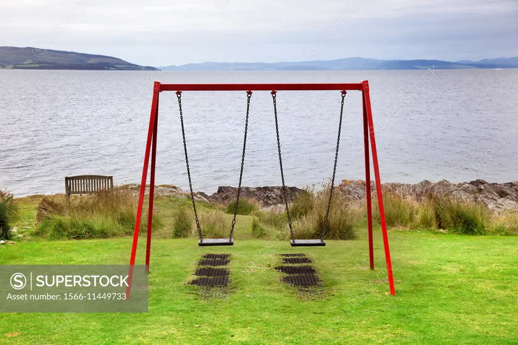 swing on seaside play equipment in Arran Island. Scotland.